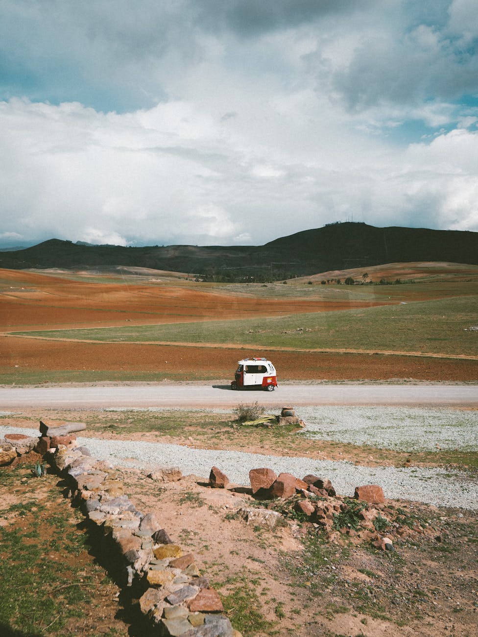 vehicle on dirt road in countryside